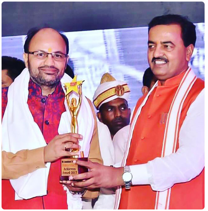 Tripathi ji, Receiving India Voice Achiever award 2017, from Hon. Deputy Chief Minister Uttar Pradesh.